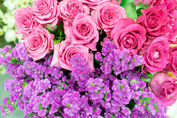 Romantic flower bunch background for anniversary and valentine day (pink roses and purple flowers)
