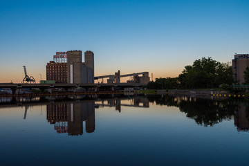 Fototapeta na wymiar Lachine Canal, Five Roses factory reflection, Montreal at dusk