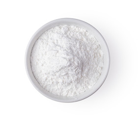 Pile of flour in white bowl isolated on white background .top view