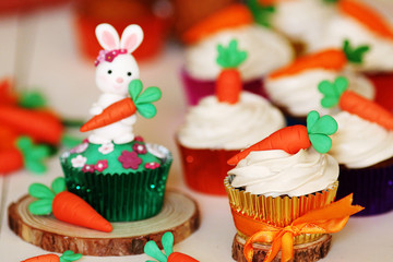 Easter cupcakes baked with carrot decorated with small figures