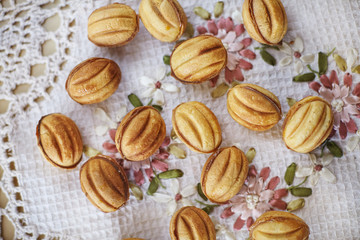 Traditional russian festive cookies in nut shape with caramelized milk inside