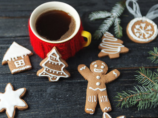 Christmas gingerbread cookies on a wooden table with a Cup of coffee