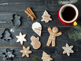 Christmas gingerbread cookies on a wooden table with a Cup of coffee