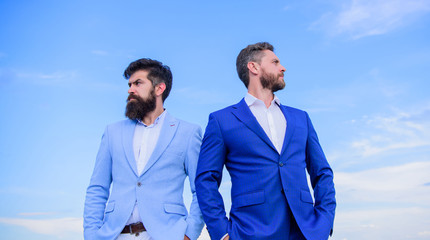 Bearded business people posing confidently. Perfect in every detail. Business men stand blue sky...