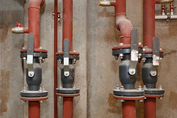 Pipes of hot water supply on the technical floor.