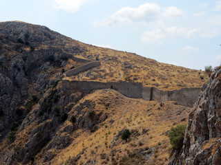 Europe, Greece,Peloponnesus,a very long wall surrounds the ancient Corinthian fortress