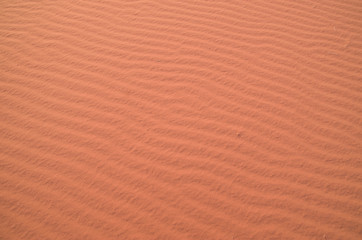 Waves in red sand  closeup in desert, Jordan