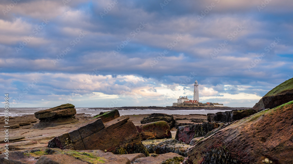 Wall mural st mary's lighthouse and rocks, taken right at the border of northumberland and north tyneside on th