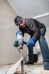 man in glasses works as perforator in pantry