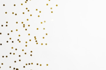 Group of gold star decoration isolated on white background top view