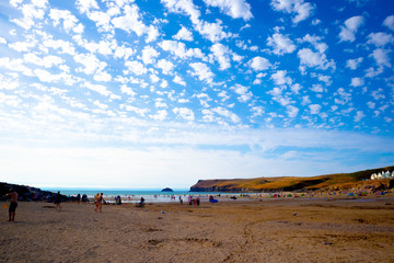 view of beach with blue sky and clouds