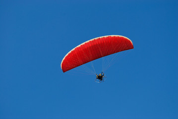 Paramotor in the blue sky