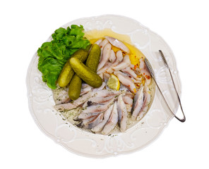 Pieces of herring fish and pickles