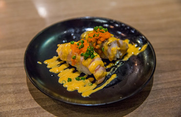 Salmon spicy shusi , in focus selective.