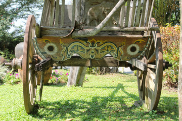 Thai style vintage wooden cart in the park.