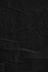 Dark black grey paper background creased crumpled surface old torn ripped posters scary grunge...
