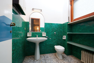 Old bathroom in normal apartment interior