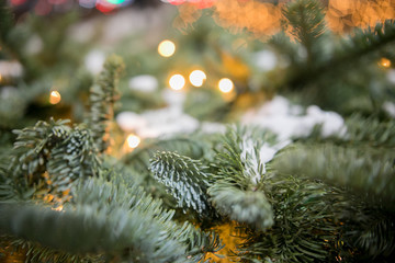 Decorated Christmas tree on  blurred, sparkling and fairy background