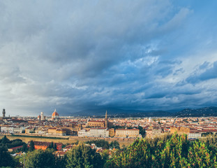 Fototapeta na wymiar Florence view of the city.Cathedral of Santa Maria del Fiore in Florence . The view from the viewpoint. Old town and brown tiles on the roofs.