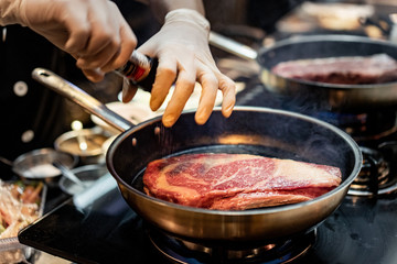 Pan sear sirloin steak cooking with chef