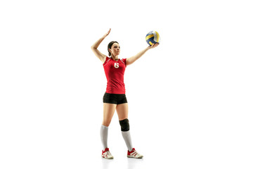 Female professional volleyball player isolated on white with ball. The athlete, exercise, action, sport, healthy lifestyle, training, fitness concept