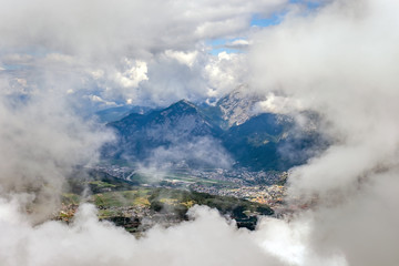 Panorama of Innsbruck in the clouds from the top of the mountain