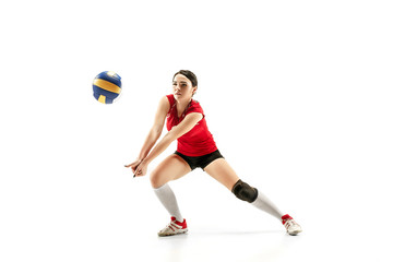 Female professional volleyball player isolated on white with ball. The athlete, exercise, action,...