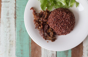 Fried sliced pork with garlic and pepper with purple rice Thai Recipes