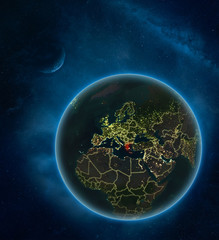 Greece at night from space with Moon and Milky Way. Detailed planet Earth with city lights and visible country borders.