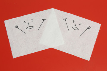 Two white toilet paper pieces sketched with discussing faces close to each others, with a shouting face, representing the panic feelings