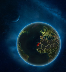 Western Sahara at night from space with Moon and Milky Way. Detailed planet Earth with city lights and visible country borders.