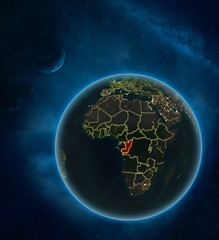 Congo at night from space with Moon and Milky Way. Detailed planet Earth with city lights and visible country borders.