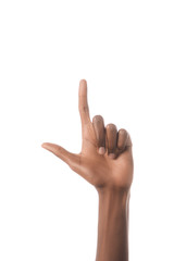 partial view of american man showing letter L in deaf and dumb language isolated on white