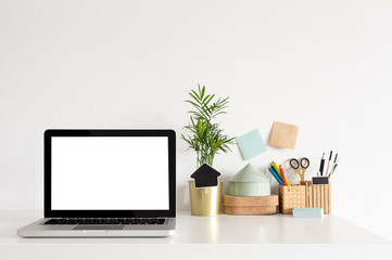 Stylish desk with laptop mock up. Minimal workspace desk of designer.	