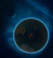 New Zealand at night from space with Moon and Milky Way. Detailed planet Earth with city lights and visible country borders.