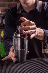 Barman show. Bartender is making cocktail at night club.