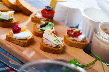 Canape with cheese, pate and vegetables