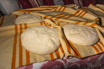 Photograph of how homemade bread is made in a wood-burning oven.