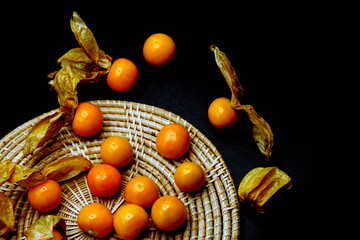 Cape gooseberry fruits (Physalis peruviana)isolated on black background.Commonly called goldenberry, golden berry, Pichuberry.