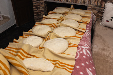 Photograph of how homemade bread is made in a wood-burning oven.