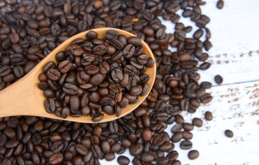 Coffee bean with coffee spoon background.
