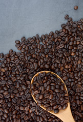 Coffee bean with coffee spoon background.