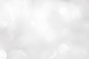 A brilliant white background with circles and ovals. Template for a holiday card with bright and sparkling lights.