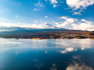 Aerial view over lake Kawaguchi, located in the border Fujikawaguchiko and Minobu, southern Yamanashi Prefecture near Mount Fuji, Japan. Lake Kawaguchi is a very popular tourist spot near Fuji Japan.