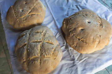 Photograph of how homemade bread is made in a wood-burning oven.