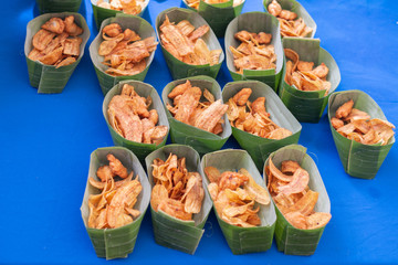 Banana chips in nature leaf cup