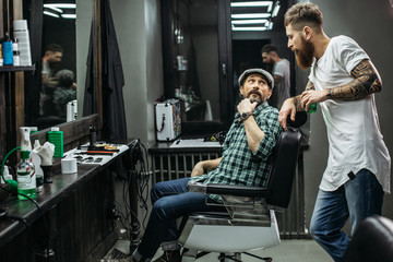 Curious man turning while talking to the barber