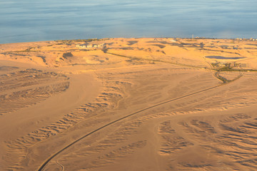 Aerial view on arabian desert and Red sea from the airplane