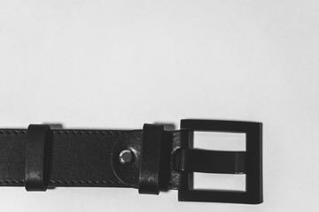 Black leather strap on white background
