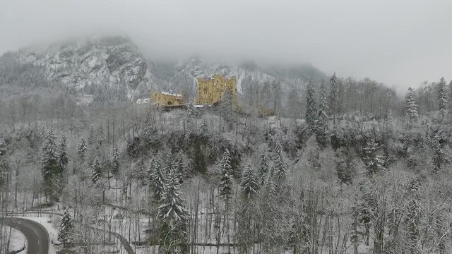 Aerial View Of Hohenschwangau getting altitude while flying towards